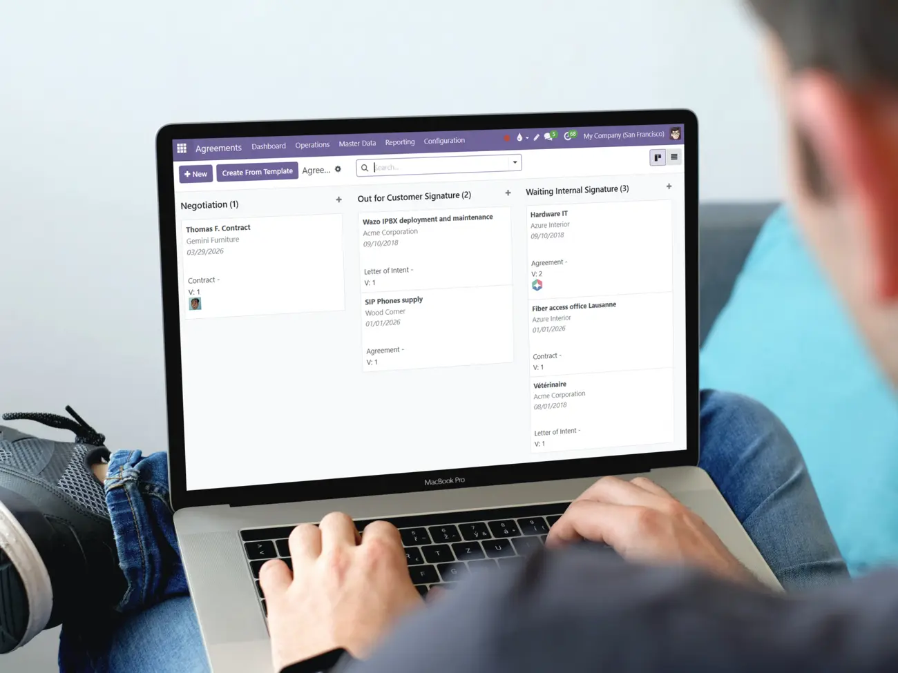 A person using a computer displaying the main screen of the Agreements app